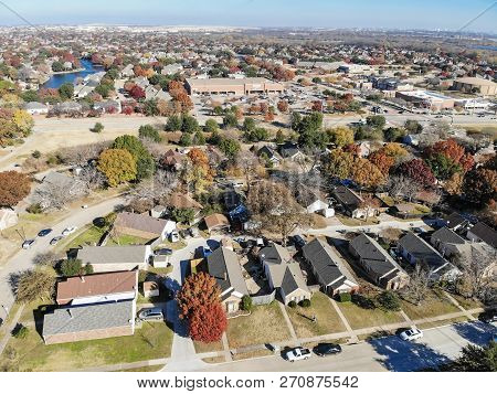 Top View Residential Neighborhood With Lake, Pond And Colorful Fall Foliage In Texas, America