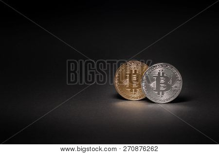 Bitcoin Gold And Silver Coin On A Black Background Close-up