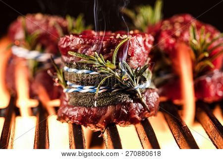 Fresh Fillet Steak On Grill With Flammes.