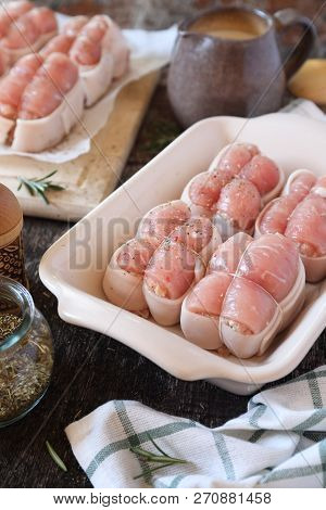 French Cuisine. Raw Meat Paupiettes,  Provencal Herbs And Jug Of Cream. Rustic Style