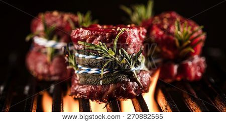 Fresh Fillet Steak On Grill With Flammes.