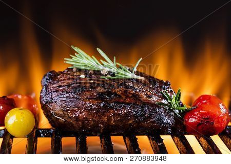 Fresh Fillet Steak On Grill With Flammes.