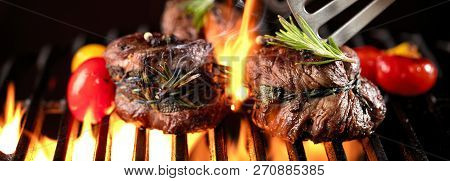 Fresh Fillet Steak On Grill With Flammes.
