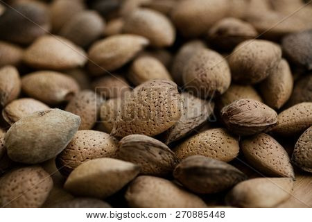 Almonds Texture And Background For Design. Close Up View Of Shelled Almonds. Heap Of Almonds. Organi