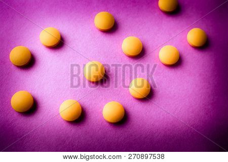 Small Yellow Orange Beautiful Medical Pharmaceptic Round Pills, Vitamins, Drugs, Antibiotics On A Pi