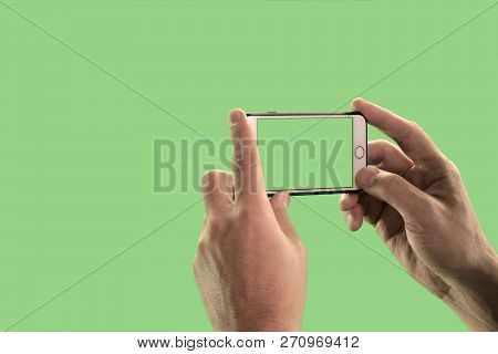 The Guy Takes Pictures Or Shoots Video On A Mobile Phone. Close-up Of The Hands Of A Man With A Gadg