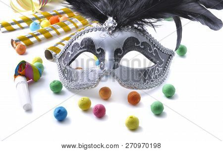 Carnival Mask Among Colorful Cotillon On White Background