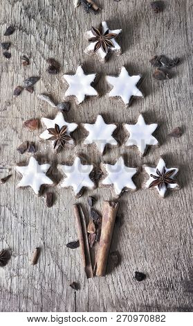 Christmas Tree Formed With White Cookies And Spices On A Plank
