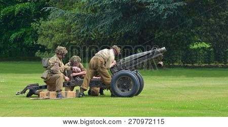 Silsoe, Bedfordshire, England - May 28, 2017:  Second World War Field Gun About To Be Fired Gunners 