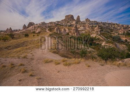 Uchisar, Cappadocia, Turkey: The Road On The Field Goes To The City And The Fortress Of Uchisar. Roc