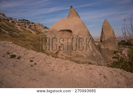 Uchisar, Cappadocia, Turkey: The Road Leads To The City And Uchisar Fortress. Rock Houses And Church