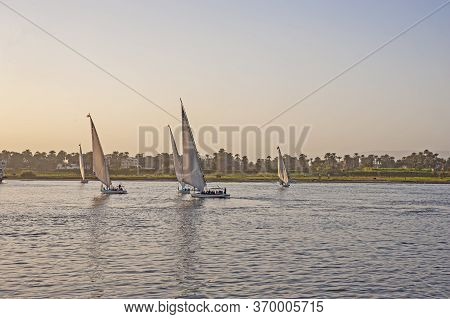 Landscape View Of Traditional Egyptian Felluca River Boats Sailing On The Nile