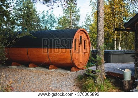 View Of Classical Swedish Camping Site With Traditional Wooden Red Cabin Cottage Houses, Lapland, No