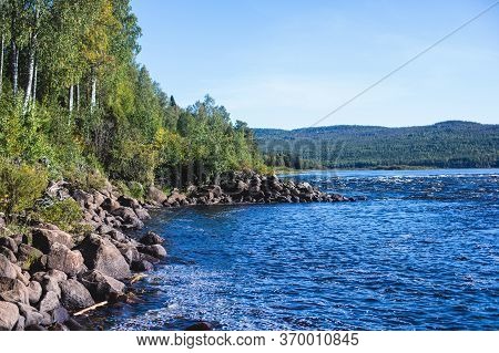 View Of Kalix River, Kalixalven, Overkalix Locality And The Seat In Norrbotten County, Sweden, With