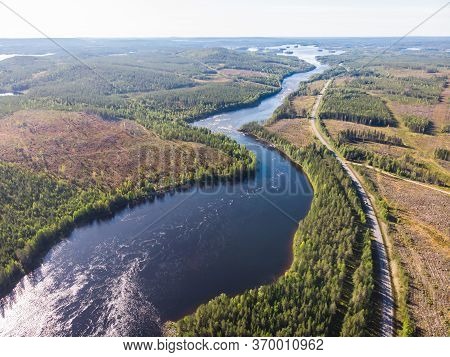 View Of Kalix River, Kalixalven, Overkalix Locality And The Seat In Norrbotten County, Sweden, With