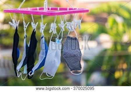 Wash The Face Mask And Dry In The Air. Handmade Own Masks To Protect From Dust Pollution And Virus E