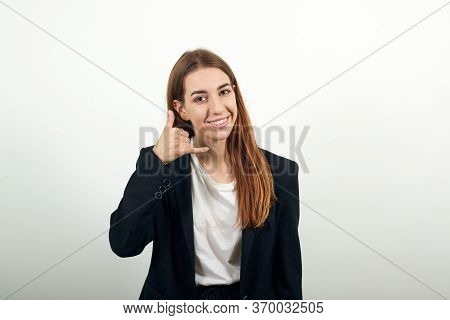Imitates Telephone Conversation, Keeps Hand Near Ear As If Holding Mobile Phone. Talking On Smartpho