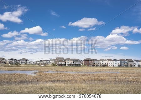 Calgary, Alberta, Canada, June 01 2020:  An subdivision developed up to designated habitat at the Ci