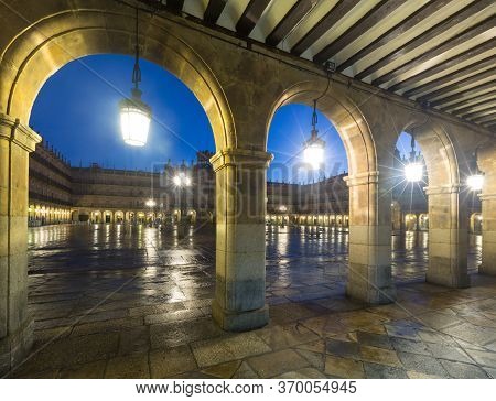Arches At Plaza Mayor At Salamanca In Evening Time. Spain