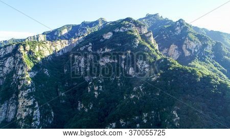Aerial View Of Green Mountain Mountain Peak With Beautiful Blue Sky. Landscape Of Mountain In Natura