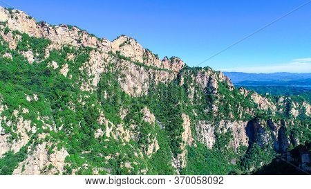 Aerial View Of Mountain With Water Reservoir On The Background With Beautiful Blue Sky. Landscape Of