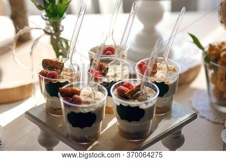 Delicious Beautiful Dessert In Cups, Delicate Cream With Raspberries And Figs, Ready For Distributio