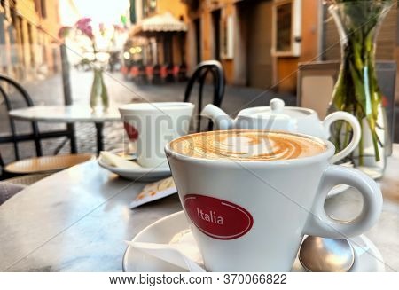 Early Morning Cappuccino At Sunrise Along Traditional Italian Street In Rome, Italy