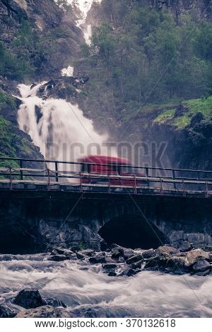 Norwegian Landscape. Waterfall Latefoss Latefossen With Stone Arched Bridge Road, Odda Hordaland Nor
