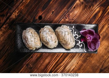 Side View On Korean Steamed Pjan-se Pigodi Pies With Cabbage And Meat , Horizontal
