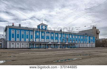 Murmansk, Russia - April 21, 2019: The Main Blue Building Of The Murmansk Sea Terminal. With Cloudy 