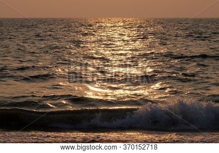 CANDOLIM, INDIA - FEBRUARY 20, 2020: Sunset at Candolim Beach, North Goa, India