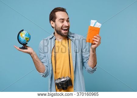 Cheerful Traveler Tourist Man In Casual Clothes With Photo Camera Isolated On Blue Background. Male 
