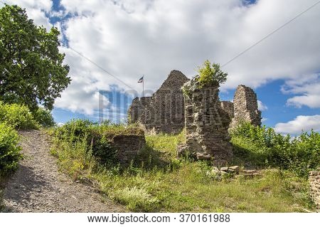 Path To The Ruins Of A Medieval Castle, Illuminated By The Sun On A Slightly Cloudy Summer Day.