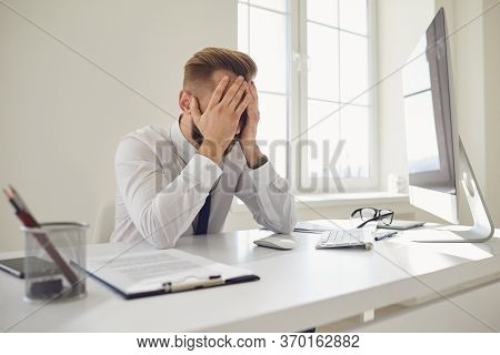 A Lot Of Work In The Office. Tired Busy Businessman Is Working With Computer.