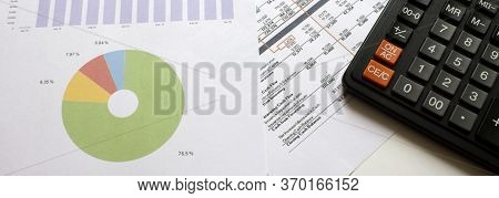 Calculator On The Business Graphs. Finance Conzept