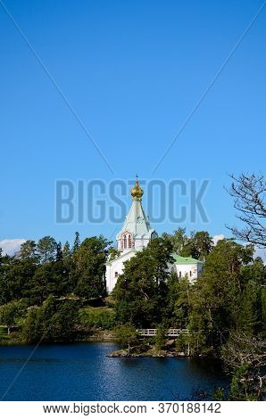 Nikolsky Skit On Valaam Island As Seen From Ladoga Lake, Vertical Photo Of Beautiful Nature. Pilgrim