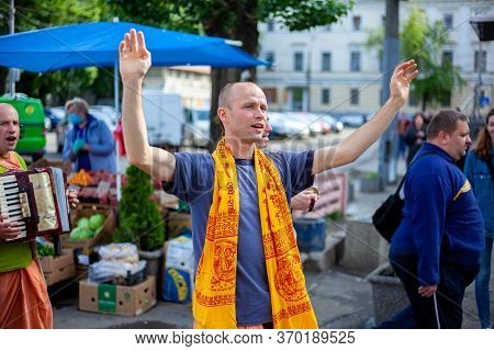 Ukraine, Kiev - June 5, 2020: Krishnaites Walk Along The Street, Sing And Dance. Religious Ukrainian