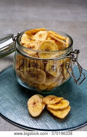 Healthy Snack, Crispy Dehydrated Unsugared Banana Chips In Glass Jar