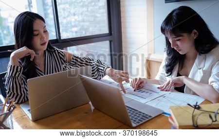 Businesswomen Meeting To Discuss Financial Graph Analysis Statistics, Company Performance Account In