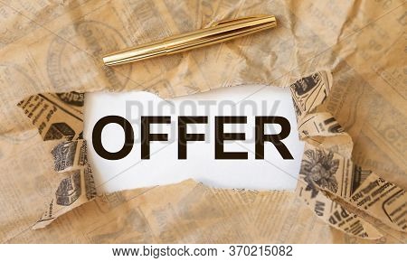 Offer Word Text Inscription On White Paper Throgh Torn Craft Paper With Golden Pen. Business Offer C