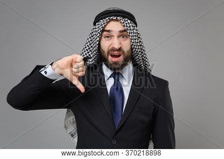 Displeased Bearded Arabian Muslim Businessman In Keffiyeh Kafiya Ring Igal Agal Classic Black Suit S