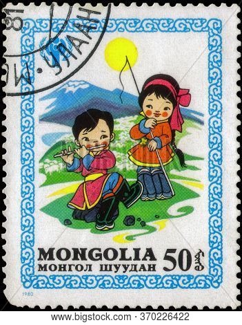 Saint Petersburg, Russia - May 17, 2020: Postage Stamp Issued In Mongolia With The Image Of Children