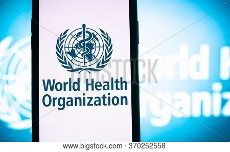 World Health Organization Logo On The Smartphone Screen In Hand. High Quality Photo