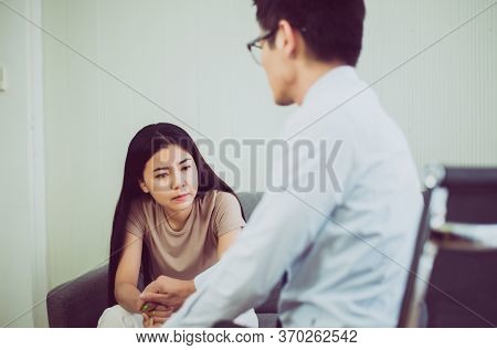 Professional Psychologist Talking With Asian Woman Patient,therapist Conducting A Consultation And C