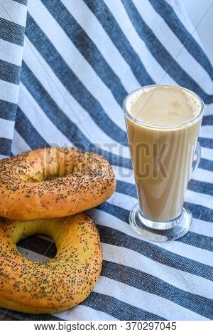 Fresh Homemade Poppy Bagels Bread With Cup Of Coffee, Latte Machiato Or Cocoa, Cappuccino, Breakfast