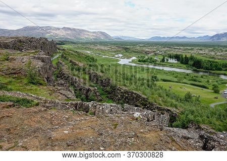 Landscape With Oxara River Near Thingvallavatn Lake With Rocky Range In Thingvellir, Iceland, Europe