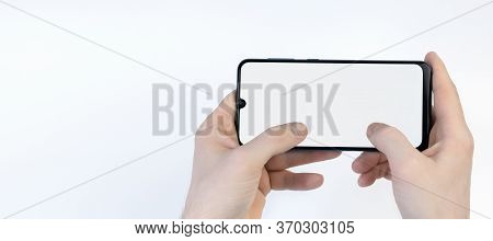 Male Hands Holding Smartphone With Blank Screen On White Background