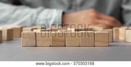 A Pile Of Empty Wood Block On Table. Business Concept For Growth Success Process. Copy Space.