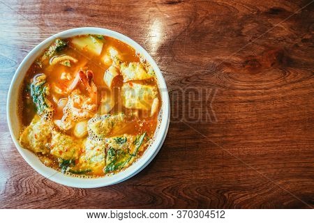 Acacia Omelets And Fresh Shrimp In Vegetable Sour Soup At Restaurant. Deep Fried Cha Om Leaves With 