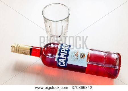 Moscow, Russia - June 4, 2020: Lying Bottle Of Campari Bitter And Empty Glass On Table. Campari Is I